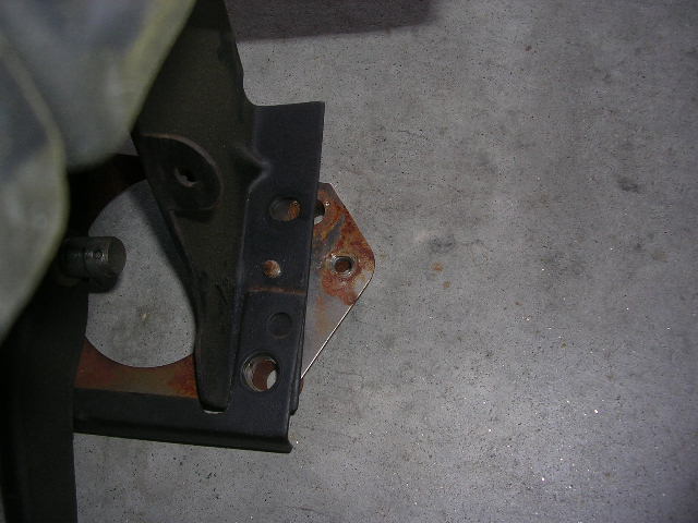Close-up of clutch pedal assembly part with rust