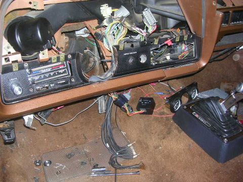 1975 Ford Ranchero - Dashboard and interior components of a vehicle with extensive wiring exposed during modification.