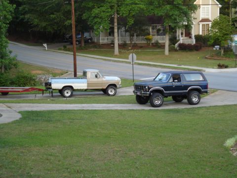1967 Ford F-250 - A Ford F-150 pickup truck and a Ford Bronco are parked on a residential driveway.