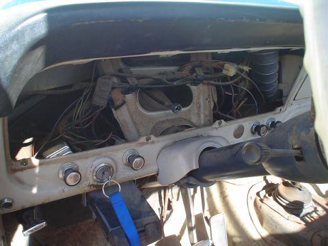 1967 Ford F-250 - The exposed dashboard wiring and ignition components of a 1967 Ford F-250 truck.
