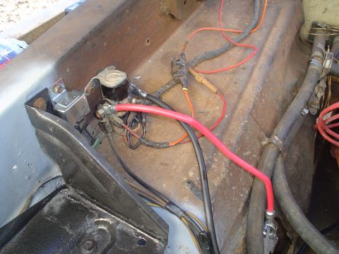 1967 Ford F-250 - The starter solenoid and a section of the vehicle's wiring harness are visible in this close-up shot.