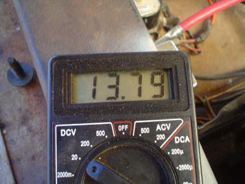1967 Ford F-250 - Digital multimeter displays 13.79 volts DCV, likely measuring battery voltage.