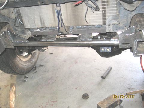 1994 Ford Bronco - Modified vehicle frame and suspension components, possibly during repair or upgrade work.