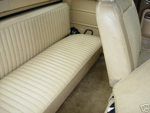 Tan vinyl bench seat and bucket seat in a 1979 Ford F-150 interior
