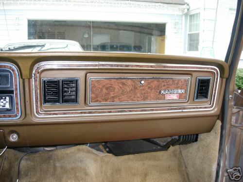 1979 Ford F-150 interior dashboard with woodgrain trim and Ranger emblem