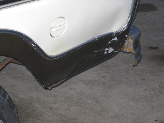 1979 Ford F-150 rear quarter panel with damage and a fuel door