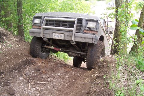 1979 Ford F-250 - This 1979 Ford F-250 is navigating a steep, muddy, off-road trail.