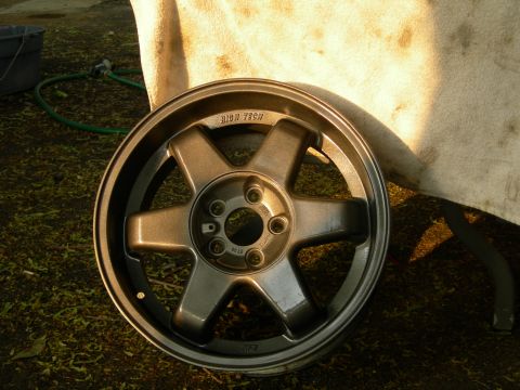 1992 Ford Taurus - Aftermarket wheel with 'HIGH TECH' cast into the spokes.