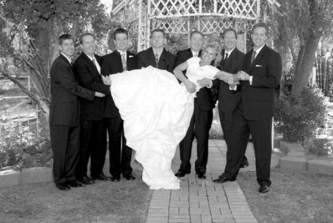 1991 Ford Bronco - A wedding party poses for a photo outdoors, with the bride being held aloft by the groomsmen.