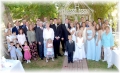 1991 Ford Bronco - A large group of people, dressed for a wedding, pose for a photo outdoors.