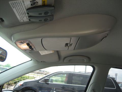 1986 Ford Bronco - Interior shot of a car's overhead console with a view of another vehicle through the window.