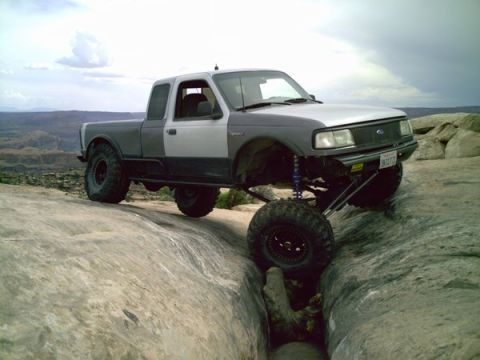 1997 Ford Ranger - This 1997 Ford Ranger navigates a narrow rocky passage with its front wheel high in the air.