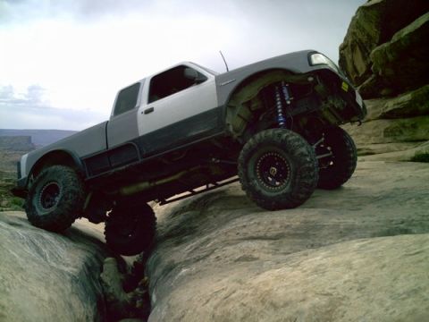 1997 Ford Ranger - This modified 1997 Ford Ranger navigates a rocky trail with its lifted suspension and aggressive tires.