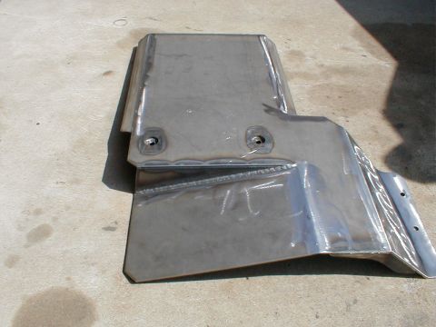 1996 Ford Bronco - Custom fabricated skid plate shown on concrete surface.