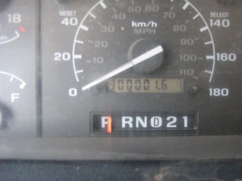 1995 Ford Bronco - Close-up of dashboard gauges, including odometer reading 30000 miles and gear selector display.