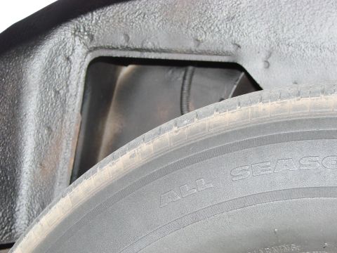 1997 Mercury Grand Marquis - There was lots of white paint in the wheel wells. I used undercoating to black it out.