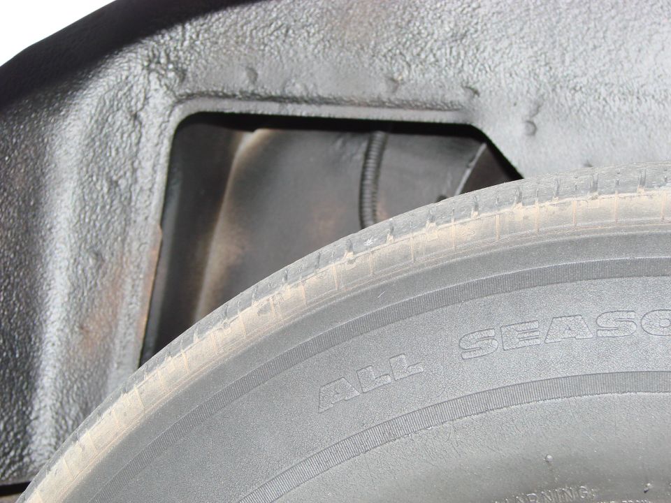 There was lots of white paint in the wheel wells.  I used undercoating to black it out.