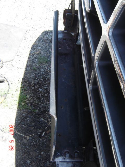 1993 Ford Bronco - Detail of a vehicle's front end, showing the grille and bumper with a timestamp in the corner.