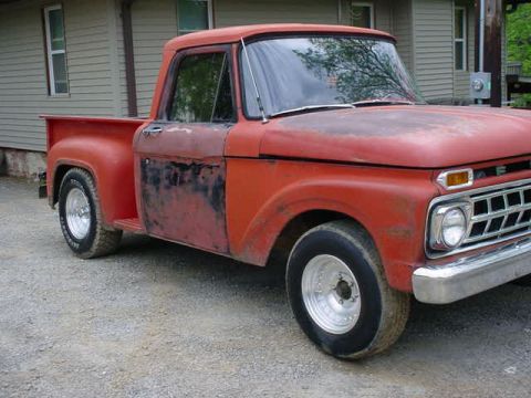 1965 Ford F-100 - This vintage pickup truck has a distinctive grille and a mismatched driver's side door.