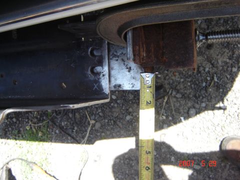 1993 Ford Bronco - Close-up of a vehicle's frame section, with a measuring tape indicating a dimension.