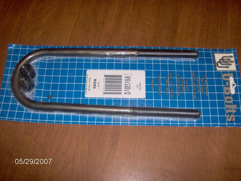 U-bolts with nuts on a blue grid background