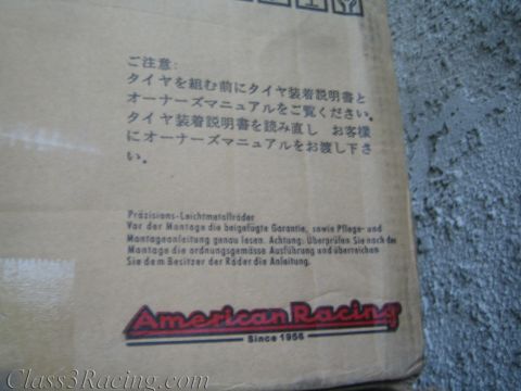 1990 Ford Bronco - Photo of an American Racing wheel shipping box printed with Japanese and German tire-mounting caution notices.