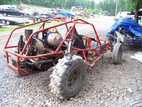 1989 Ford Bronco II - Custom dune buggy chassis with exposed engine and large off-road tires, parked outdoors.