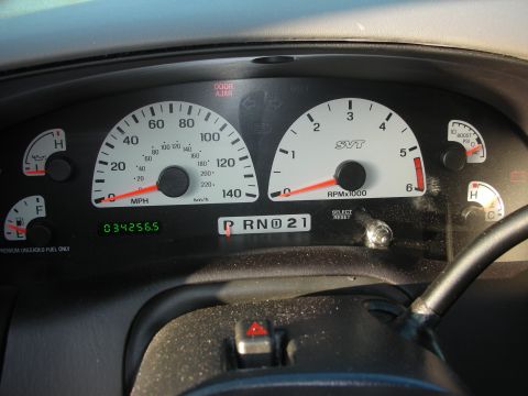 1998 Ford Crown Victoria - The dashboard gauges display 'SVT' branding, indicating a performance variant, but no specific year is visible.