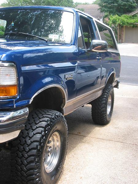 1996 Ford Bronco - This blue 1996 Ford Bronco features a lifted suspension and aggressive off-road tires.