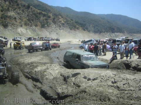 1987 Suzuki Samurai - Off-road vehicles are stuck in the mud at a popular off-roading spot.