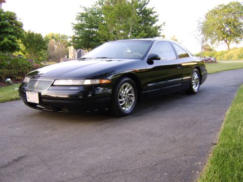 1996 Mercury Grand Marquis - Lincoln Mark VIII coupe with chrome wheels sits on a paved driveway next to a lawn.