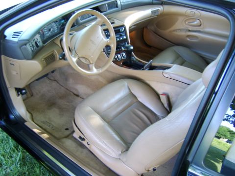 1996 Mercury Grand Marquis - Tan leather interior of a 1995 Lincoln Continental, front seats and dashboard details.