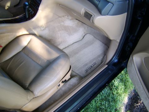 1996 Mercury Grand Marquis - Embroidered floor mats reading 'MARK VIII' are visible inside a car.