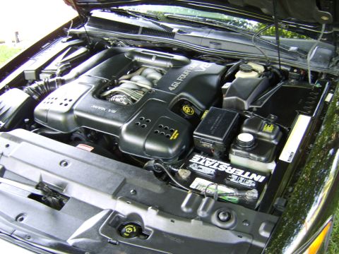 1996 Mercury Grand Marquis - Engine bay of a 1996 Mercury Grand Marquis, showing the 4.6L V8 engine during initial cleaning.