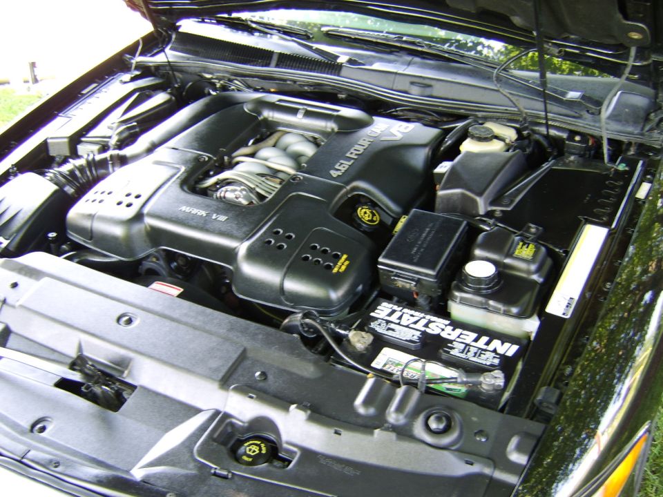 Engine bay showing 4.6L V8 with Mark VIII cover and Interstate battery