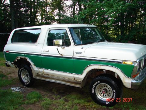 1978 Ford Bronco - This 1978 Ford Bronco features a distinctive white and green two-tone paint scheme and is shown from a 3/4 front perspective.