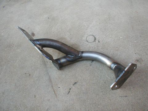 1996 Ford Bronco - Custom bent exhaust pipe with flanges, likely for a vehicle modification.