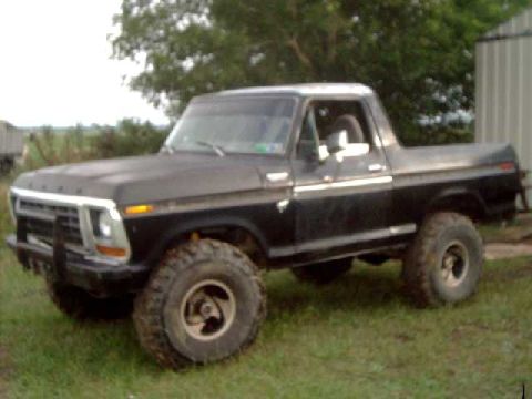 1978 Ford Bronco - This black 1978 Ford Bronco features prominent off-road tires and a classic body style.