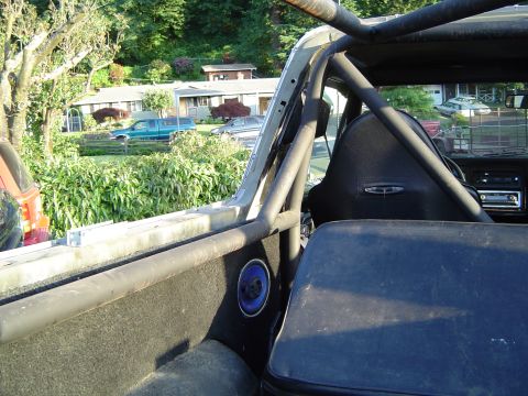 1978 Ford Bronco - Modified 1978 Ford Bronco interior showing roll cage and custom seats.