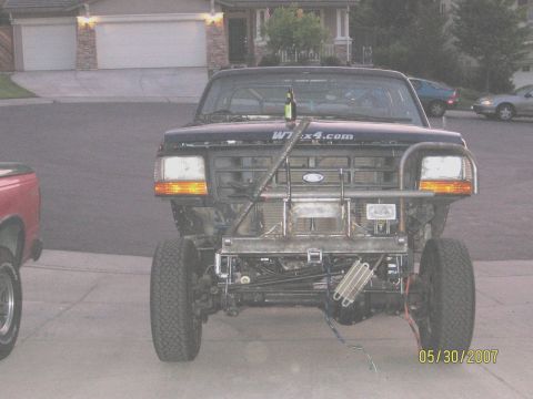 1994 Ford Bronco - Front view of a modified 1994 Ford Bronco, showing custom bumper and off-road modifications.