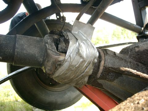1991 Chevrolet Suburban - Universal joint on a vehicle's driveshaft appears to be repaired with tape.