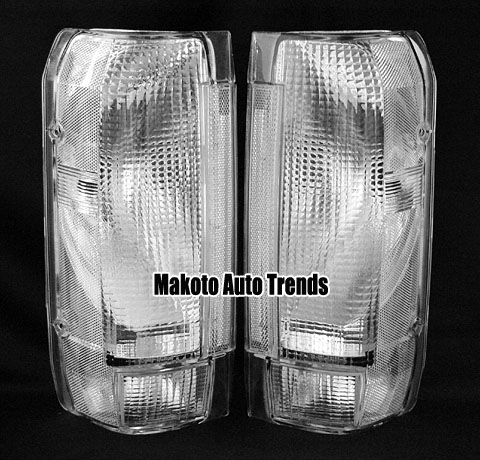 1993 Ford C-350 (Centurion Conversions) - Two clear tail light lenses are shown against a black background. The lenses have a textured pattern.