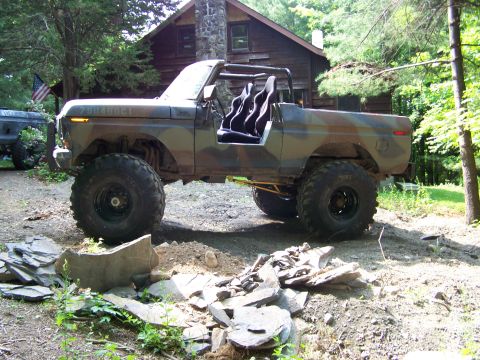 1979 Ford Bronco - This modified 1979 Ford Bronco is equipped for off-road adventures, a camouflage paint job and large tires.