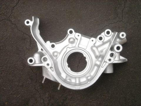 1991 Ford Taurus - This is an aluminum oil pump housing, likely for an engine.