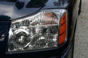 2007 Nissan Titan - Close-up of a truck's front headlight assembly, showing the turn signal and headlight lens.