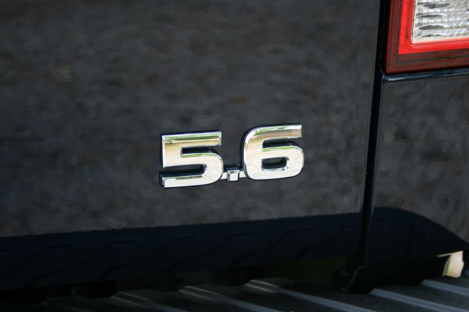 Close-up of 5.6 badge on the rear of a black 2007 Nissan Titan