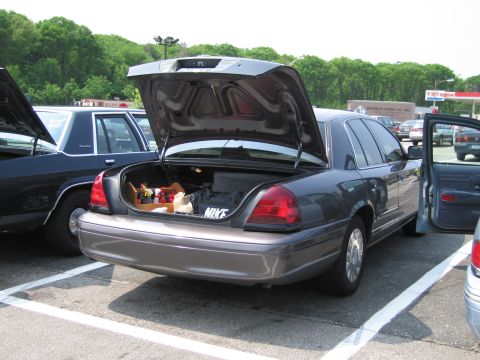 1991 Ford LTD Crown Victoria - Trunk of a Ford Crown Victoria is open, revealing items and a Nike bag.
