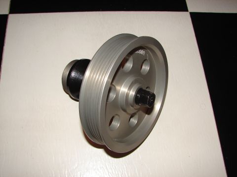 1992 Ford Taurus - A single pulley part is shown against a checkered background.