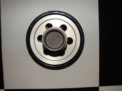 1992 Ford Taurus - This is a close-up view of an oil filter, a common automotive part.
