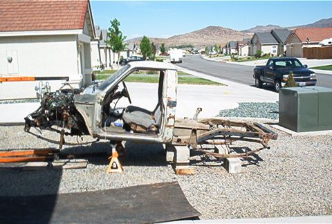 1982 Toyota 4Runner - This disassembled truck chassis is elevated on jack stands, revealing its internal components and interior.